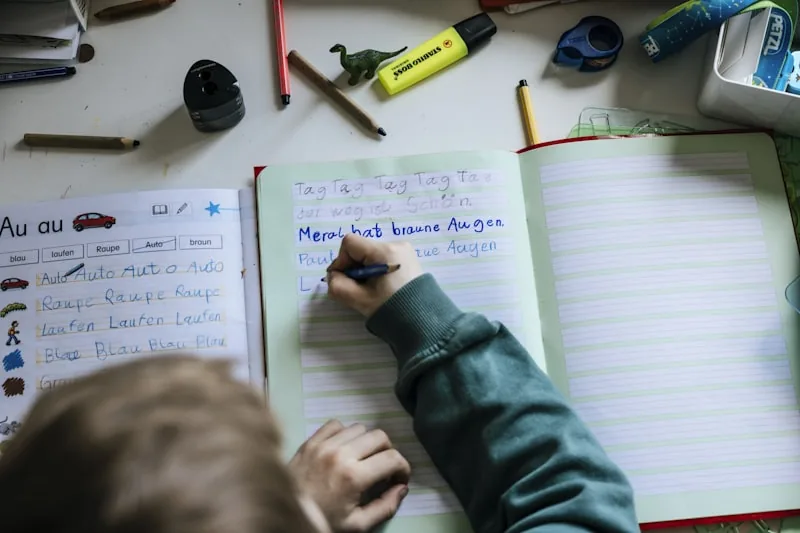 A child writing in a notebook