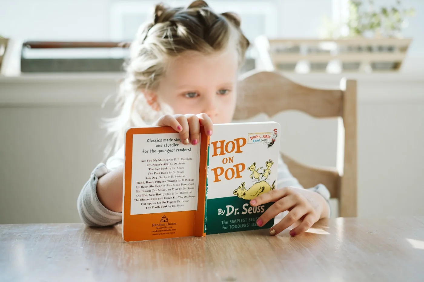 A young student reading a favorite picture book