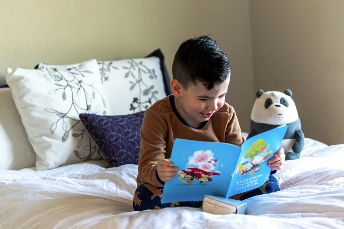 A child happily reading a book